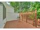 Cozy backyard deck with privacy lattice and a metal table and chairs at 5547 Sea Daisy Dr, Raleigh, NC 27606