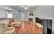 Cozy living room with fireplace, light colored walls, hardwood flooring, and neutral furnishings at 5547 Sea Daisy Dr, Raleigh, NC 27606