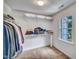 Walk-in closet with shelves and clothing racks, providing ample storage and organization at 5547 Sea Daisy Dr, Raleigh, NC 27606