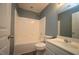 Bathroom with combination tub and shower, and classic white fixtures at 5927 Hourglass Ct, Raleigh, NC 27612