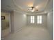 Spacious bedroom with a tray ceiling, fan and a walk-in closet at 5927 Hourglass Ct, Raleigh, NC 27612