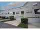 Inviting townhome featuring neutral siding, multi-car garage and well maintained landscaping at 5927 Hourglass Ct, Raleigh, NC 27612