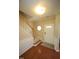 Welcoming foyer features hardwood floors, carpeted stairs, decorative rug, and traditional light fixture at 5927 Hourglass Ct, Raleigh, NC 27612