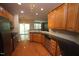 Stylish kitchen with granite countertops, stainless steel appliances, and hardwood floors at 5927 Hourglass Ct, Raleigh, NC 27612