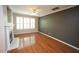 Comfortable living room featuring hardwood floors, fireplace, and white crown molding at 5927 Hourglass Ct, Raleigh, NC 27612