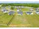 Beautiful aerial view of a home with large fenced backyard and surrounding residential neighborhood at 60 Heart Pine Dr, Wendell, NC 27591