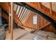 Unfinished attic with wooden beams, potential for customized storage or additional living space at 60 Heart Pine Dr, Wendell, NC 27591
