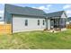 Wide backyard with a screened-in porch and outdoor seating at 60 Heart Pine Dr, Wendell, NC 27591