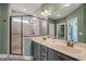 Bathroom featuring a walk-in shower, double sink vanity, and a walk-in closet at 60 Heart Pine Dr, Wendell, NC 27591
