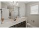 Bright bathroom featuring a sink, window, and a shower at 60 Heart Pine Dr, Wendell, NC 27591