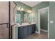 This bathroom features a double sink vanity, tiled shower, and decorative floor tiles at 60 Heart Pine Dr, Wendell, NC 27591