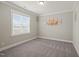 Bedroom with carpet flooring, a window, and an accent wall at 60 Heart Pine Dr, Wendell, NC 27591