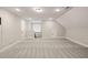 Bright bonus room featuring carpet, neutral walls, recessed lighting, and stairway access at 60 Heart Pine Dr, Wendell, NC 27591