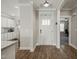 Bright foyer with wood floors, white trim, and easy access to kitchen and office at 60 Heart Pine Dr, Wendell, NC 27591