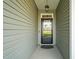 Welcoming front entryway with a glass door and sidelights, providing ample natural light into the home at 60 Heart Pine Dr, Wendell, NC 27591