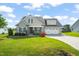 Charming home with a well-manicured lawn and inviting curb appeal at 60 Heart Pine Dr, Wendell, NC 27591