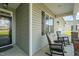 Inviting front porch with rocking chairs, offering a cozy outdoor space to enjoy the neighborhood views at 60 Heart Pine Dr, Wendell, NC 27591