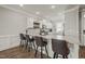 Bright kitchen featuring a large island with barstool seating and granite countertops at 60 Heart Pine Dr, Wendell, NC 27591