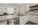 Open kitchen with a view of the living room and fireplace, featuring granite countertops at 60 Heart Pine Dr, Wendell, NC 27591