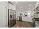 Open-concept kitchen boasts stainless steel appliances and a seamless transition to the living room at 60 Heart Pine Dr, Wendell, NC 27591