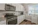 Well-lit kitchen featuring modern stainless steel appliances and stylish decor at 60 Heart Pine Dr, Wendell, NC 27591