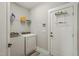Functional laundry room with modern washer and dryer, plus convenient shelving at 60 Heart Pine Dr, Wendell, NC 27591