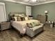 Cozy main bedroom featuring a large bed and stylish accent furniture at 60 Heart Pine Dr, Wendell, NC 27591