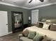 Stylish main bedroom featuring a large mirror, accent furniture and neutral color scheme at 60 Heart Pine Dr, Wendell, NC 27591