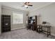 Office room featuring a ceiling fan, desk, chair, and carpet at 60 Heart Pine Dr, Wendell, NC 27591