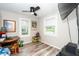 Cozy bedroom with wood-look flooring, neutral walls, and two bright windows for lots of natural light at 607 E Granville St, Dunn, NC 28334