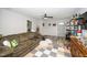Spacious living room featuring wood-look floors, a brown couch, and an open view to the entryway at 607 E Granville St, Dunn, NC 28334