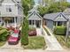 Aerial shot of a charming home with a metal roof, a welcoming porch, and a beautiful yard at 616 Dorothea Dr, Raleigh, NC 27603