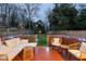 Inviting back deck with cozy seating, ambient lighting, and a serene backyard view at 616 Dorothea Dr, Raleigh, NC 27603