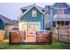 Backyard with wooden deck and festive lighting, perfect for outdoor entertaining at 616 Dorothea Dr, Raleigh, NC 27603
