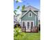 Charming backyard view with a well-maintained lawn, privacy fence and quaint home exterior at 616 Dorothea Dr, Raleigh, NC 27603