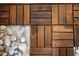 Unique flooring pattern featuring dark-stained wood planks and smooth white stones at 616 Dorothea Dr, Raleigh, NC 27603