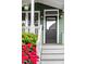 Inviting front entrance with a stylish black door and well-manicured landscaping at 616 Dorothea Dr, Raleigh, NC 27603