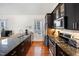 Kitchen featuring granite countertops, stainless steel appliances, and hardwood floors at 616 Dorothea Dr, Raleigh, NC 27603