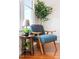 Cozy reading nook with comfortable chair, side table, and plant at 616 Dorothea Dr, Raleigh, NC 27603