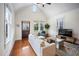 Bright living room with large windows, hardwood floors, and comfortable seating at 616 Dorothea Dr, Raleigh, NC 27603