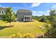 Expansive green backyard with a screened-in porch at 638 Boulder Point Dr, Chapel Hill, NC 27516