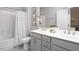Beautiful bathroom with double vanity, framed mirrors, and shower/tub combo at 638 Boulder Point Dr, Chapel Hill, NC 27516