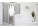 Bright bathroom showcasing soaking tub, a glass enclosed shower, and stylish tile for a spa-like feel at 638 Boulder Point Dr, Chapel Hill, NC 27516
