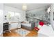 This bedroom has a cozy daybed, decorative city mural, wood floors and built in desk at 638 Boulder Point Dr, Chapel Hill, NC 27516