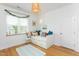 This light and bright bedroom features wood floors, built-in shelves and whimsical decor at 638 Boulder Point Dr, Chapel Hill, NC 27516