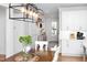 Bright dining area with a modern chandelier and hardwood floors at 638 Boulder Point Dr, Chapel Hill, NC 27516