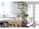Open concept with view from dining room to kitchen with island and modern lighting at 638 Boulder Point Dr, Chapel Hill, NC 27516