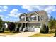 Traditional home with a covered front porch and a two-car garage at 638 Boulder Point Dr, Chapel Hill, NC 27516
