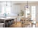 Open concept featuring kitchen island, modern appliances and dining area at 638 Boulder Point Dr, Chapel Hill, NC 27516