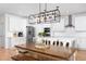 Spacious kitchen featuring a large island and modern lighting fixtures at 638 Boulder Point Dr, Chapel Hill, NC 27516